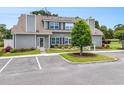 Lovely condo featuring well-maintained landscaping, gray siding, and easy parking at 503 N 20Th Ave. N # 41D, North Myrtle Beach, SC 29582