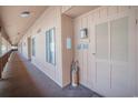 Hallway view to unit entrance with a pelican statue and exterior light at 5505 N Ocean Blvd. # 303, Myrtle Beach, SC 29577