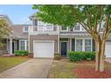 Charming two-story home featuring a balcony, garage, and well-maintained landscaping at 6172 Catalina Dr. # 414H, North Myrtle Beach, SC 29582