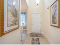 Bright foyer with tile flooring, artwork, and a view into the dining area at 6172 Catalina Dr. # 414H, North Myrtle Beach, SC 29582