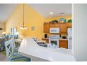 Bright kitchen with a breakfast bar, updated appliances, and an open floorplan at 6172 Catalina Dr. # 414H, North Myrtle Beach, SC 29582