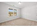 Bright bedroom featuring a large window with a view of the outdoors at 655 Snowy Owl Way, Conway, SC 29527