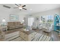 Comfortable living room with cozy seating, wood floors, and a stylish striped rug at 668 Rycola Circle, Surfside Beach, SC 29575