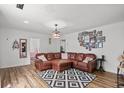Spacious living room with a cozy seating area, hardwood floors, and unique decor at 708 15Th Ave., Conway, SC 29526