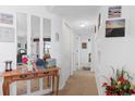 Welcoming entryway decorated with mirrors and decorative artwork creating an inviting space at 8861 Chandler Dr. # F, Surfside Beach, SC 29575