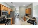 Galley style kitchen with stainless steel appliances, granite countertops, and lots of storage space at 100 Culpepper Way # 1003, Myrtle Beach, SC 29579