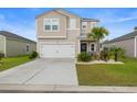 Charming two-story home with a well-manicured lawn and attached two-car garage at 1078 Saltgrass Way, Myrtle Beach, SC 29588