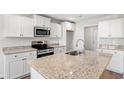 Modern kitchen featuring granite counters, stainless steel appliances, and a sink in the island at 1111 Woodside Dr., Conway, SC 29526