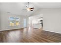 Inviting living room featuring wood floors, abundant natural light, and an open kitchen at 1111 Woodside Dr., Conway, SC 29526