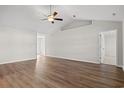 Bright living room with high ceilings, modern ceiling fan and durable wood flooring at 1111 Woodside Dr., Conway, SC 29526