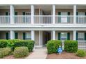 View of the front entrance of a condo with stairs to the units at 1125 Blue Stem Dr. # 29F, Pawleys Island, SC 29585