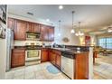 Well-equipped kitchen featuring dark wood cabinetry, stainless steel appliances, and granite countertops with eat in kitchen at 118 Birch N Coppice Dr. # 6, Surfside Beach, SC 29575