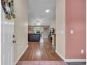 View from the front door into a hardwood floored hallway leading to the living room at 1206 Formby Ct., Myrtle Beach, SC 29588