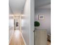 Hallway featuring beautiful, light colored wood floors and stylish beach themed decor at 1210 N Ocean Blvd. # 104, Surfside Beach, SC 29575