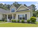 Charming single-Gathering home with inviting front porch and manicured landscaping at 1448 Tiger Grand Dr., Conway, SC 29526