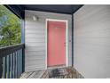 Condo entrance with painted door and wood deck offers private access to the unit at 1500 Cenith Dr. # B-403, North Myrtle Beach, SC 29582