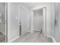 Bright condo entryway with closet and light-grey wood-look flooring, ready for your personal touch at 1500 Cenith Dr. # B-403, North Myrtle Beach, SC 29582