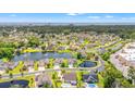 Picturesque aerial shot of a residential neighborhood with a scenic lake and lush green surroundings near the ocean at 1715 Lake Egret Dr., North Myrtle Beach, SC 29582