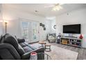 Comfortable living room with modern furnishings and exterior access at 2005 Silvercrest Dr. # 32F, Myrtle Beach, SC 29579