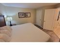 Comfortable bedroom showcasing a queen bed, side tables, and decorative wall art at 201 S Ocean Blvd. # 205, Myrtle Beach, SC 29577