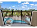 Balcony view of the pool and palm trees at 2300 N Ocean Blvd. # 132, Myrtle Beach, SC 29577
