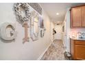Stylish hallway with wood-look flooring and decorative wall art, leading to a welcoming home at 247 Grove Park Grove Park Loop, Murrells Inlet, SC 29576