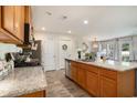 Well-appointed kitchen featuring granite countertops, stainless steel appliances, and ample cabinet space at 247 Grove Park Grove Park Loop, Murrells Inlet, SC 29576