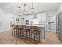 Spacious kitchen featuring a large island with seating, stainless steel appliances, and modern finishes at 2554 Dogwood Rd., Longs, SC 29568