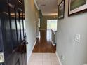 Welcoming entryway with wood floors leading to a spacious living area, enhanced by natural light at 256 Connemara Dr. # 13-C, Myrtle Beach, SC 29579
