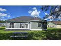 The backyard has a concrete patio and a well-manicured lawn at 2715 Wood Creek Ln., Conway, SC 29527