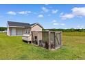 A chicken coop is adjacent to an outbuilding and provides a place to raise chickens at 3617 Pasture Rd., Aynor, SC 29511