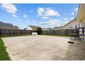 Large concrete backyard offering ample space for outdoor activities and entertaining at 402 Bristlecone St., Longs, SC 29568