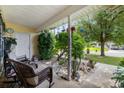 Relaxing covered porch featuring comfortable seating and decorative garden accents at 402 Bristlecone St., Longs, SC 29568