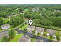 Aerial view showing the property's location within a neighborhood surrounded by lush greenery at 448 Mahogany Dr. # 201, Murrells Inlet, SC 29576