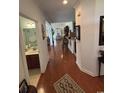 Long hallway with hardwood floors leading to the bathroom and dining area at 448 Mahogany Dr. # 201, Murrells Inlet, SC 29576