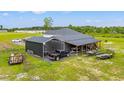 The property features covered parking and workshop, offering ample space for vehicles and projects at 4486 Bethel Rd., Aynor, SC 29511
