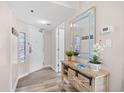 Bright entryway with a mirror, console table and view of door at 4800 S Ocean Blvd. # 514, North Myrtle Beach, SC 29582