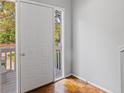 Bright entryway featuring hardwood floors and a view of the outdoor porch at 482 Greenview Dr. # 5B, Johnsonville, SC 29555