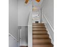 View of painted staircase with wooden steps, leading to the upper level of the home at 482 Greenview Dr. # 5B, Johnsonville, SC 29555