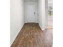 Hallway with hard surface floors and contrasting white trim and walls at 572 Woodland Farms Circle, Aynor, SC 29511