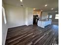Spacious living room with hardwood floors, natural light, seamlessly connects to the kitchen for modern living at 594 Castillo Dr., Loris, SC 29569