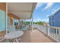 Large porch with outdoor seating and views of the neighborhood at 6001 - Mh 17A South Kings Hwy., Myrtle Beach, SC 29575