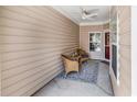 Cozy covered porch with seating and ceiling fan at 637 Botany Loop # 64, Murrells Inlet, SC 29576