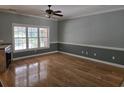 Bright living room boasts hardwood floors and a large window allowing for natural light at 6542 Wellington Dr., Murrells Inlet, SC 29576