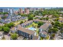 Aerial view of condo community featuring pool, surrounding neighborhood and ocean views at 7700 Porcher Dr. # 3205, Myrtle Beach, SC 29572