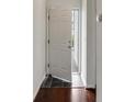 Open doorway leading to the home's interior with dark wood and tile flooring at 964 Great Egret Circle Sw # B, Sunset Beach, NC 28468