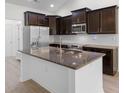 Spacious kitchen featuring a center island with granite countertops, and stainless steel appliances at 124 Shady Arbor Loop, Longs, SC 29568