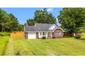 Attractive single story brick home with well kept lawn and inviting curb appeal at 2965 Mount Olive Rd., Loris, SC 29569