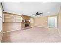 Spacious living room featuring a brick fireplace, built-in shelving, and ample natural light at 300 Crescent Dr., Conway, SC 29526