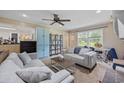 Cozy living room with comfortable seating, neutral tones, and a ceiling fan at 300 Crescent Dr., Conway, SC 29526